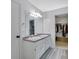 Bright bathroom with double sinks and walk-in closet provide ample storage and convenience at 402 Wood Chase Ln, Canton, GA 30114