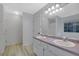Bright bathroom boasts a double sink vanity, large mirror, and plenty of counter space at 402 Wood Chase Ln, Canton, GA 30114