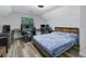 Bedroom with vaulted ceilings and wood-look floors features versatile space at 402 Wood Chase Ln, Canton, GA 30114