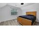 Bedroom with wood-look floors and natural light offers a comfortable retreat at 402 Wood Chase Ln, Canton, GA 30114