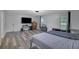Spacious bedroom with wood-look floors features a large television and ample storage at 402 Wood Chase Ln, Canton, GA 30114