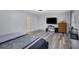 Generous bedroom with wood-look floors, neutral decor, and TV set up at 402 Wood Chase Ln, Canton, GA 30114