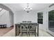 Bright dining area featuring a modern table set with four chairs and a stylish chandelier at 402 Wood Chase Ln, Canton, GA 30114