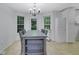 Eat-in kitchen featuring a gray table set with four chairs and lots of natural light at 402 Wood Chase Ln, Canton, GA 30114
