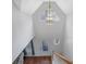 Bright foyer with high ceilings features a decorative chandelier and beautiful front door at 402 Wood Chase Ln, Canton, GA 30114