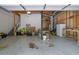 Spacious garage featuring concrete floors, exposed ceiling elements, and room for storage at 402 Wood Chase Ln, Canton, GA 30114