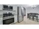 Modern kitchen featuring stainless steel appliances, granite countertops, and updated cabinets at 402 Wood Chase Ln, Canton, GA 30114