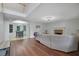 Open-concept living room featuring hardwood floors leading to dining area at 402 Wood Chase Ln, Canton, GA 30114