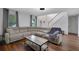 Spacious living room featuring hard wood floors and a large sectional at 402 Wood Chase Ln, Canton, GA 30114