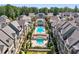 Breathtaking aerial view of a neighborhood pool featuring stately homes and manicured greenery at 6635 Beacon Dr, Atlanta, GA 30328