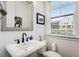 Chic powder room with a modern sink, fixtures, and a large window at 6635 Beacon Dr, Atlanta, GA 30328