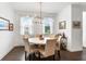 Cozy dining room features a round table, modern lighting, and ample natural light at 6635 Beacon Dr, Atlanta, GA 30328