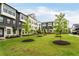 Charming townhomes with well-manicured lawn and young trees create an inviting curb appeal at 6635 Beacon Dr, Atlanta, GA 30328