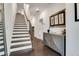 Inviting home hallway with a staircase, wood flooring, and stylish decor provides a warm entrance at 6635 Beacon Dr, Atlanta, GA 30328
