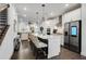 Open-concept kitchen features a large island, stainless appliances, and seamless flow to the living area at 6635 Beacon Dr, Atlanta, GA 30328
