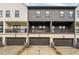 Attractive townhome exteriors with brick garages and balconies, showcasing modern architecture at 6635 Beacon Dr, Atlanta, GA 30328