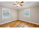 Bright bedroom showcasing pristine hardwood floors and windows for natural light at 1539 Marbut Se Ave, Atlanta, GA 30316