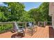 Relax on the wood deck surrounded by lush greenery, perfect for outdoor enjoyment and entertaining at 1539 Marbut Se Ave, Atlanta, GA 30316