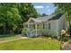 Landscaped front yard and inviting exterior with a charming yellow front door at 1539 Marbut Se Ave, Atlanta, GA 30316