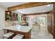 Open kitchen with wooden beams, a central island, and stainless steel appliances at 1539 Marbut Se Ave, Atlanta, GA 30316
