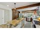 Large kitchen with a central island, wooden beams, and stainless steel appliances with an open layout at 1539 Marbut Se Ave, Atlanta, GA 30316