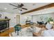 Spacious living room with hardwood floors, fireplace, ceiling fan, and comfortable seating area at 1539 Marbut Se Ave, Atlanta, GA 30316