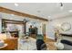 Open living space featuring hardwood floors, exposed beams, and a cozy fireplace at 1539 Marbut Se Ave, Atlanta, GA 30316
