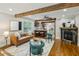 Spacious living area with hardwood floors, a fireplace, and an open layout to the kitchen at 1539 Marbut Se Ave, Atlanta, GA 30316