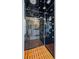 Luxury shower with multiple shower heads, wooden floor, and glass door at 1539 Marbut Se Ave, Atlanta, GA 30316