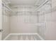 Bright walk-in closet equipped with adjustable white shelving for organized storage solutions at 1539 Marbut Se Ave, Atlanta, GA 30316