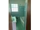 Bathroom featuring a tub, vanity, window, and blue tiling at 2703 Arrowood Dr, East Point, GA 30344