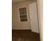 A bedroom with a window, a door, and brown carpet at 449 Hamilton E Holmes Nw Dr, Atlanta, GA 30318