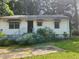 Modest single story home with white siding and red and white awnings at 449 Hamilton E Holmes Nw Dr, Atlanta, GA 30318