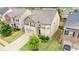 An aerial shot of a house highlighting its position in a lush, green neighborhood at 556 Emporia Loop, Mcdonough, GA 30253