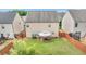 Aerial view of a fenced backyard with a large lawn and gazebo, perfect for outdoor gatherings at 556 Emporia Loop, Mcdonough, GA 30253