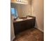 Bathroom featuring a double vanity with granite countertops, tile floor, and ample lighting at 556 Emporia Loop, Mcdonough, GA 30253