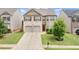 Beautiful two-story house with brick and siding, a two-car garage, and a well-kept front lawn at 556 Emporia Loop, Mcdonough, GA 30253