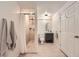 Clean bathroom with a tiled shower, vanity, and tile flooring at 5940 Plantation Dr, Roswell, GA 30075