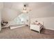 Attic bedroom with carpet, sloped ceilings, and two bed platforms at 5940 Plantation Dr, Roswell, GA 30075