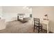 Carpeted bedroom with a desk area and neutral-colored furniture at 5940 Plantation Dr, Roswell, GA 30075