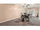Bonus room featuring plush carpeting, white walls, ceiling fan, and drum set at 5940 Plantation Dr, Roswell, GA 30075