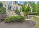 Close-up of front entrance highlighting the stonework, landscaping and wrought iron railing at 5940 Plantation Dr, Roswell, GA 30075