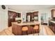 Spacious kitchen featuring a center island with seating, stainless steel appliances, and granite countertops at 5940 Plantation Dr, Roswell, GA 30075