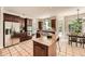Modern kitchen with stainless steel appliances, granite countertops, and a central island at 5940 Plantation Dr, Roswell, GA 30075