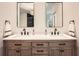 Large main bathroom with dual vanity, wood cabinets, and framed mirrors at 5940 Plantation Dr, Roswell, GA 30075