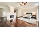 Relaxing main bedroom with hardwood floors, tray ceiling, and lots of light at 5940 Plantation Dr, Roswell, GA 30075