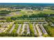An aerial shot of a neat townhome community, conveniently located near schools and shopping centers, offering an ideal lifestyle at 1851 Grove Way, Hampton, GA 30228