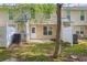 A cozy, fenced backyard with a small patio and easy access to the home's interior, perfect for outdoor relaxation at 1851 Grove Way, Hampton, GA 30228