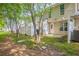 A spacious backyard with privacy fence, lawn, and small patio area for outdoor enjoyment and entertaining at 1851 Grove Way, Hampton, GA 30228