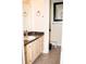 Bathroom showcasing wood cabinets and tile floors at 2592 King Louis Ne Rd, Conyers, GA 30012